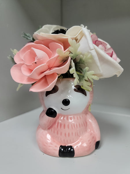 Wood Floral Arrangement In Pink Ceramic Sloth Container