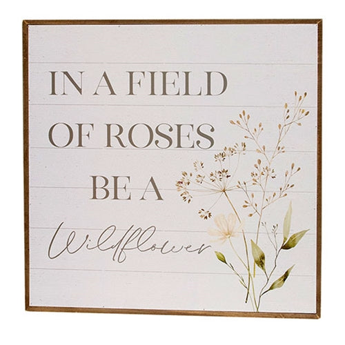 In A Field Of Roses Be a Wildflower Framed Print